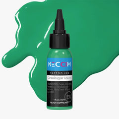 A bottle of NECCH Tattoo Ink in Grasshopper Green, set against a large green paint splash on a light gray background.