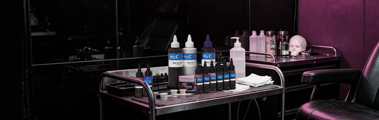 A salon or beauty supply cart holding multiple bottles and containers, including two white bottles with blue labels reading neccih brand logo, set in a dimly lit room with a black chair and purple ambient lighting.
