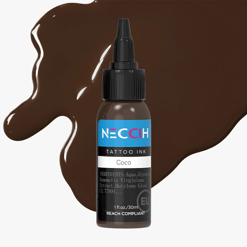 NECCIH Coco Tattoo Ink bottle with a black cap and a blue label, shown on a light gray background with brown ink splatters.