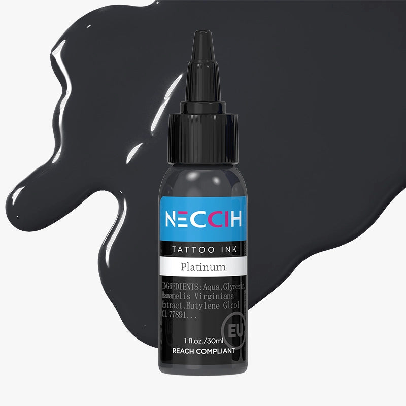 A bottle of NECOH Tattoo Ink in the shade Platinum, shown against a light gray background with decorative black ink splatters.