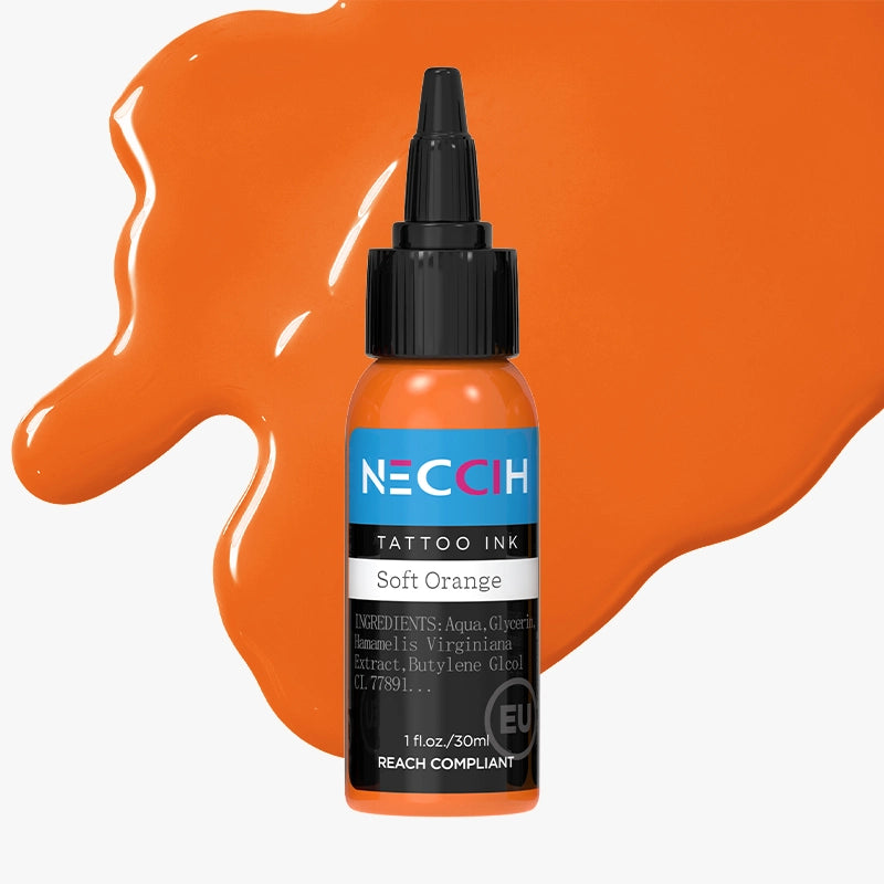 A bottle of NECCIH Soft Orange tattoo ink with a black cap, set against a light gray background with decorative orange paint splatters.