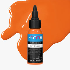 A bottle of NECCIH Soft Orange tattoo ink with a black cap, set against a light gray background with decorative orange paint splatters.